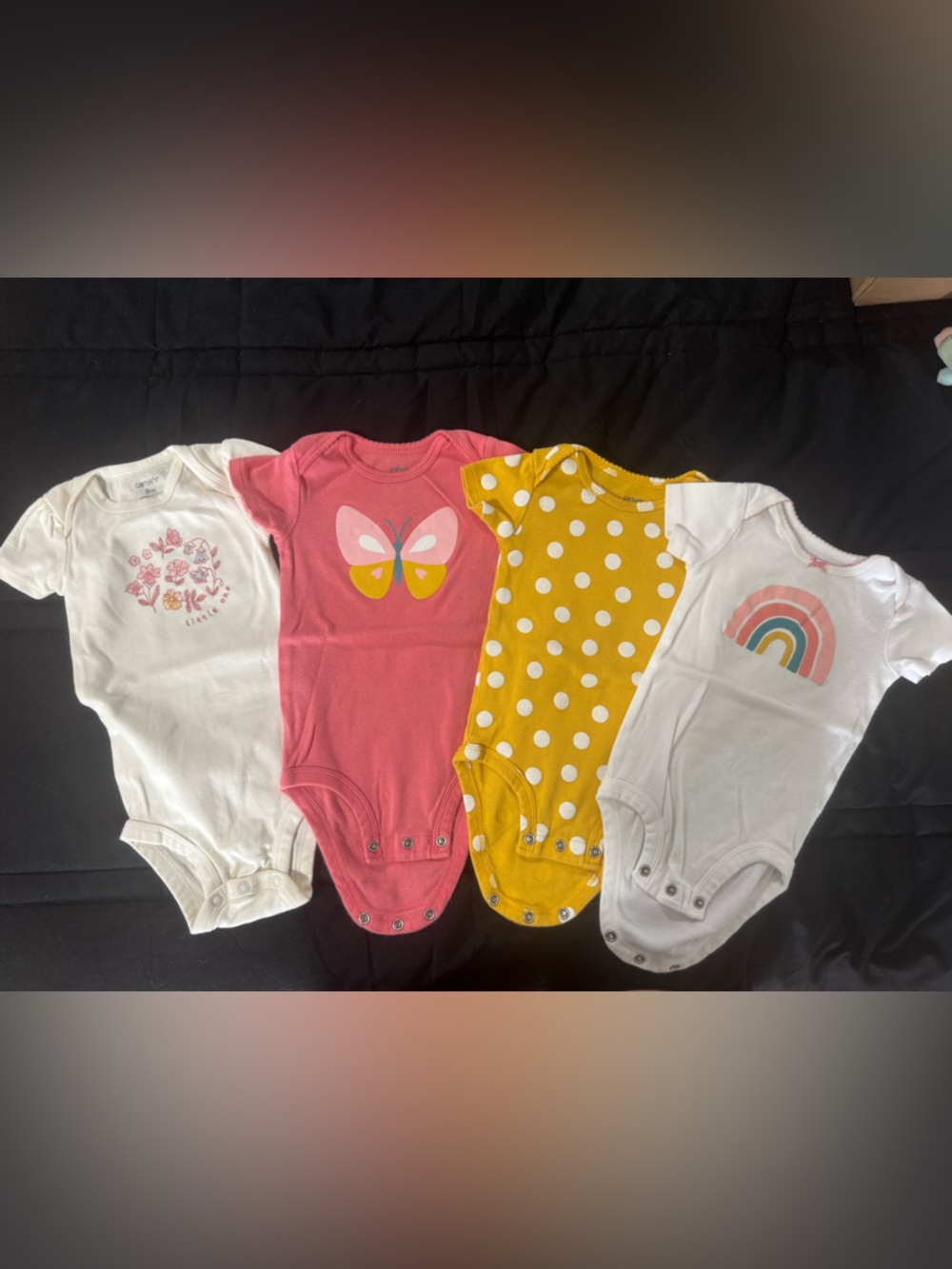Carter's White, Pink, Yellow, and Coral Baby One-Piece Bodysuits - 4 Pack